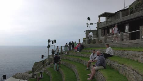 Panning-shot-of-tourists-taking-in-the-views-on-display-at-the-Minack-Theater