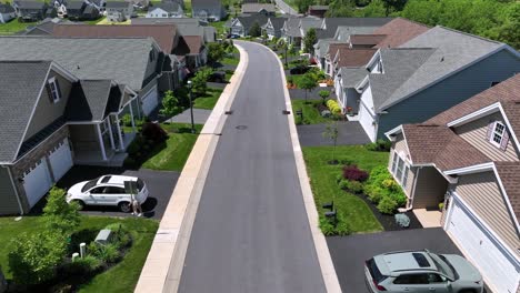 Walking-Resident-on-sidewalk-of-street-in-american-neighborhood