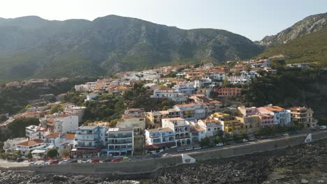 Seaside-Townhouses-In-Cala-Gonone-Surrounded-By-Mountains-In-Sardinia,-Italy