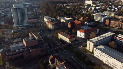 Downtown-Street-Traffic-in-Kaiserslautern-Town-at-Golden-Hour,-Static-Drone-View