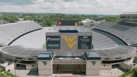 Mountaineer-Field-at-Milan-Puskar-Stadium,-home-of-the-West-Virginia-University-Mountaineers-football-team-in-Morgantown,-West-Virginia-with-drone-video-pulling-back