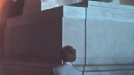 Woman-Closely-Admires-Sculpture-of-Abraham-Lincoln-at-the-Memorial-Monument