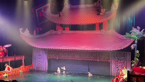 Thang-Long-Water-Puppet-Show-splashing-playing---Hanoi,-Vietnam