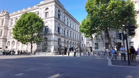 A-sunny-morning-scene-at-10-Downing-Street-with-police-waiting-for-a-dignitary-while-the-road-is-closed-off