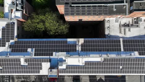 Solar-panels-on-roof-of-buildings-in-american-city-during-sunny-day