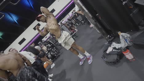 An-African-American-man-admires-his-toned-physique-in-the-reflection-of-the-mirror