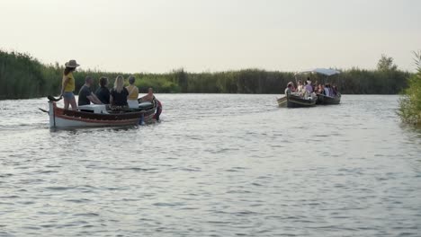 Tourists-riding-a-boat-in-the-Valencian-Albufera-at-sunset