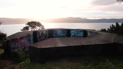 WW2-bunkers-with-graffiti-overlooking-harbour-view-at-The-Massey-Memorial-on-Point-Halswell-in-Wellington,-New-Zealand-Aotearoa