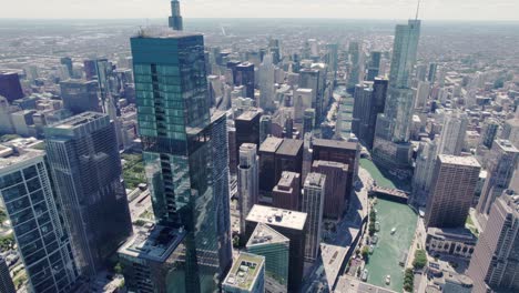 Aerial-Chicago-downtown-skyline-building-and-drone-view-along-skyscrapers-at-sunny-day