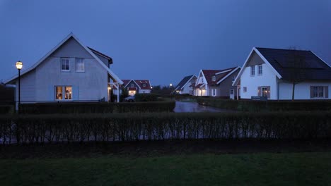 Modern-luxury-houses-at-twilight-in-a-private-real-estate-park-in-Arcen,-Limburg