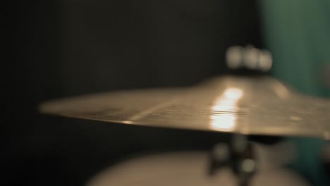 Slow-motion-close-up-of-a-drummer-striking-a-cymbal-once