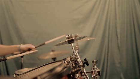 Slow-motion-close-up-of-a-drummer-striking-cymbals-with-drumsticks