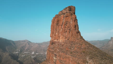 Roque-Bentayga:-cinematic-aerial-shot-in-orbit-of-the-famous-emblem-of-the-island-of-Gran-Canaria,-Tejeda,-Canary-Islands,-Spain