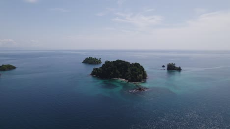 Unspoiled-nature-on-tiny-island-in-the-vast-open-ocean,-isla-coco-Panama,-aerial