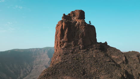 Roque-Bentayga:-cinematic-aerial-shot-of-the-famous-monolith-on-the-island-of-Gran-Canaria,-Tejeda,-Canary-Islands,-Spain