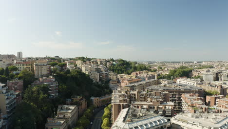 Drone-rises-from-new-luxury-apartment-buildings-to-reveal-overview-of-Trastevere-neighborhood-Rome-Italy