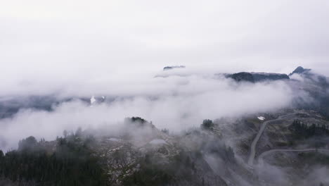 Aerial-panoramic-descending-overview-rocky-boulder-fields-above-Northern-Cascade-region