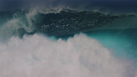 Tracking-pan-follows-crashing-dangerous-ocean-wave-erupting-with-mist-and-whitewash-in-slow-motion