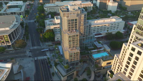 Aerial-view-of-downtown-Los-Angeles,-California,-USA-at-sunset,-highlighting-the-city's-urban-character-and-ambiance