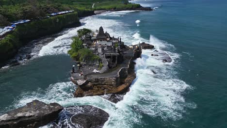 Tanah-Lot-epitomizes-the-beautiful-romantic-island-of-Bali,-aerial-parallax