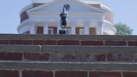 The-Rotunda-on-the-campus-of-the-University-of-Virginia-in-Charlottesville,-Virginia-with-gimbal-video-moving-up-steps-to-Thomas-Jefferson-statue