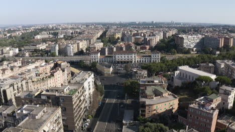 Panoramic-aerial-dolly-to-train-station-in-middle-of-Trastevere-neighborhood-Rome-Italy