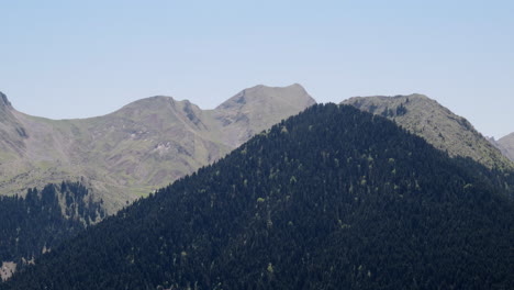 Panning-right-shot-mountain-ridge-spring-snow-covered-mountain-peaks