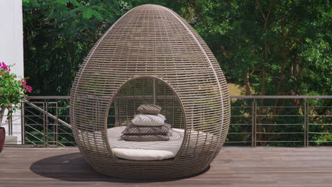 Outdoor-Modern-Rattan-Relax-Chair-On-The-Poolside-At-Renaissance-Bali-Uluwatu-Resort-And-Spa-In-Bali,-Indonesia