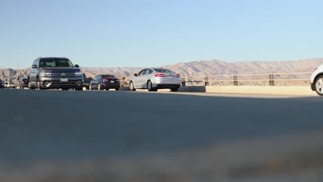 Car-traffic-on-bridge-over-interstate-highway-in-Indio,-California,-USA