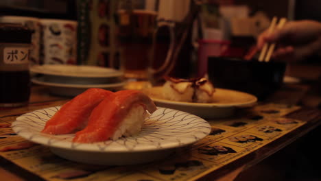 Sushi-being-Eaten-in-Tokyo-Japan