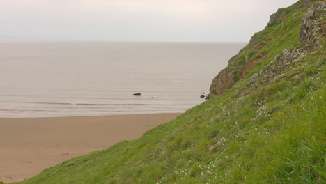 Panoramic-view-of-cliff-sea-at-Bread-Down,-England