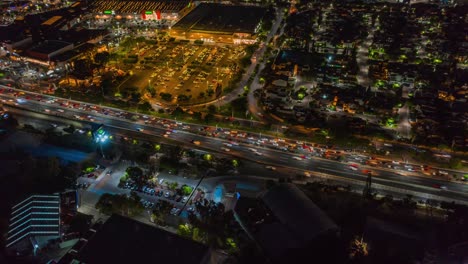 Flight-with-drone-the-city-at-night-during-the-traffic-hour,-queretaro-mexico,-4k-hdr