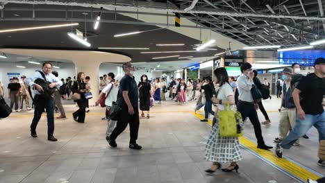 Metro-train-passengers-walking-inside-the-station-Footage-of-moving-people-at-an-indoor-location