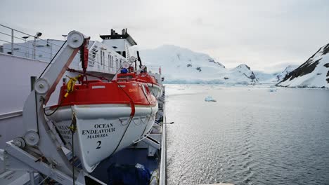 Antarctica-Ship-and-Beautiful-Scenery,-Cruise-Ship-Boat-in-Dramatic-Amazing-Antarctic-Peninsula-Mountains-Scenery-and-Winter-Landscape-on-Tourist-Travel-Vacation-and-Holiday-to-Antarctica