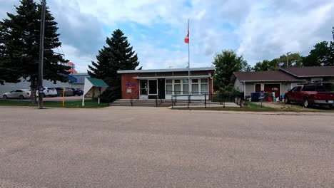 Hartney,-MB,-Canada---07-16-2024:-The-historic-post-office-basks-in-the-warm-glow-of-a-summer-afternoon,-a-peaceful-reminder-of-simpler-times-in-this-charming-Manitoba-town