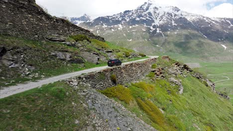 Car-driving-along-dangerous-mountain-road-at-Mount-Cenis-in-France