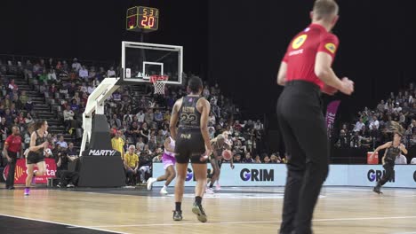 Slow-motion-shot-of-a-basketballer-dribbling-through-a-press-at-a-competition