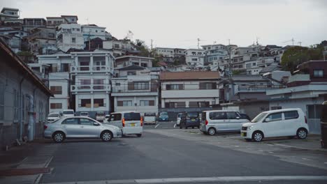 Urban-car-park-in-Saikazaki,-a-cape-town-in-southern-Wakayama,-Japan