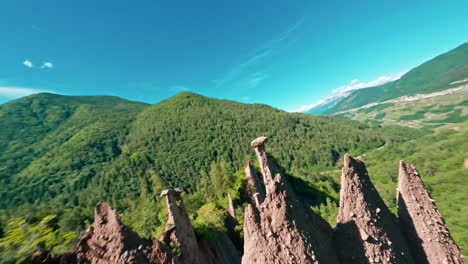 Sunlit-view-of-the-unique-rock-formations-at-Piramidi-di-Terra-di-Segonzano-in-the-Italian-Alps