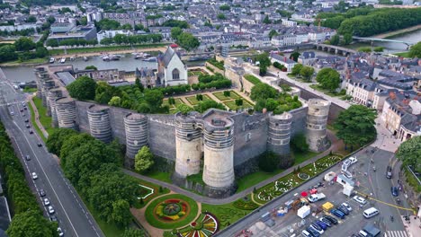 High-altitude-aerial-view-about-the-Château-d'Angers-castle-and-its-gardens,-Angers,-France