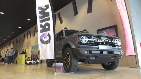 Slow-establishing-shot-of-a-Ford-Bronco-on-display-at-a-car-show