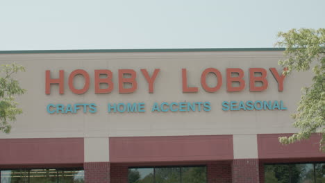 Hobby-Lobby-store-sign-in-East-Lansing,-Michigan-with-stable-wide-shot