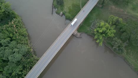 Aerial-View-of-Cauca-River-Near-Bridge-with-Passing-Cars