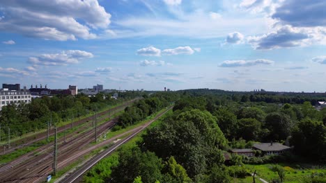 Railroad-line-parallel-to-the-park-with-path-on-a-sunny-summer-day