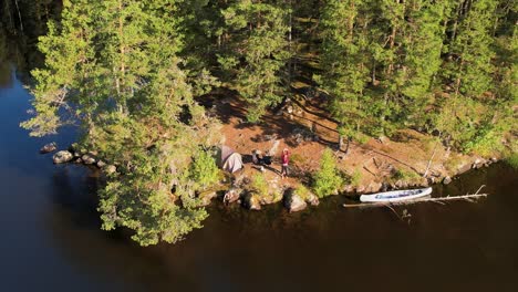 Scenic-aerial-view-of-an-island-surrounded-by-water-and-lush-trees-in-Värmland,-Sweden