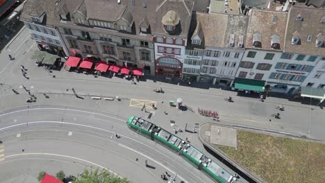 4K-Drone-Video-of-Train-Station-and-Trains-in-Basel,-Switzerland-with-Historic-Buildings,-Gothic-Churches,-and-Modern-Opera-House