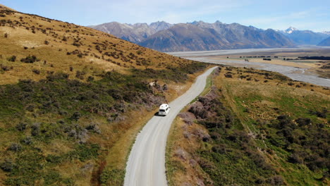 Travel-Van-life-New-Zealand-mountains-and-lake-Drone-following-4k