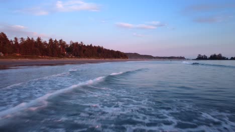 Hyperlapse-drone-flying-over-ocean-water-and-beach-on-coast-of-Canada