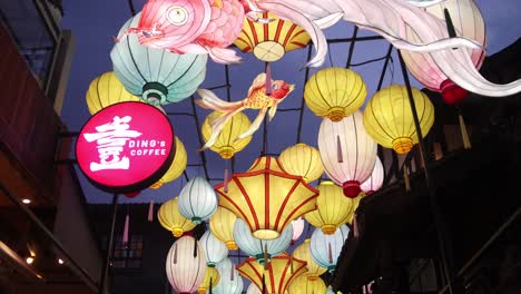 Vibrant-and-colorful-lanterns-hanging-in-a-street-festival-in-Chengdu,-China,-creating-a-festive-and-lively-atmosphere