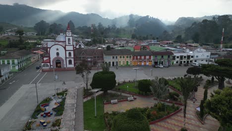 Flyover-of-charming-sleepy-Latin-American-mountain-town-in-sun-beams